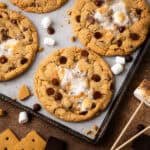 S'more chocolate chip cookies laying on a baking sheet.