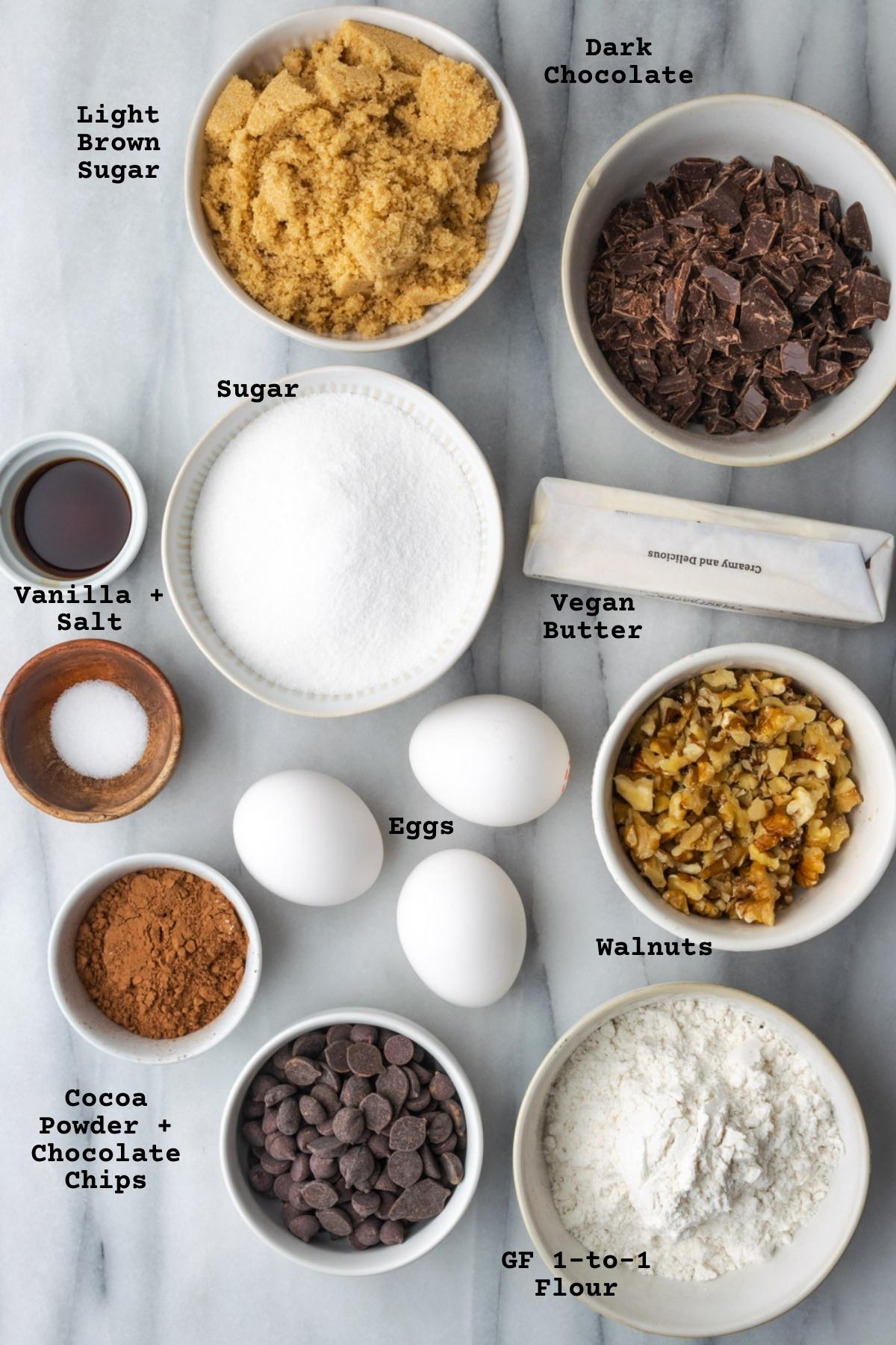 Ingredients for gluten free brownies on a marble table.
