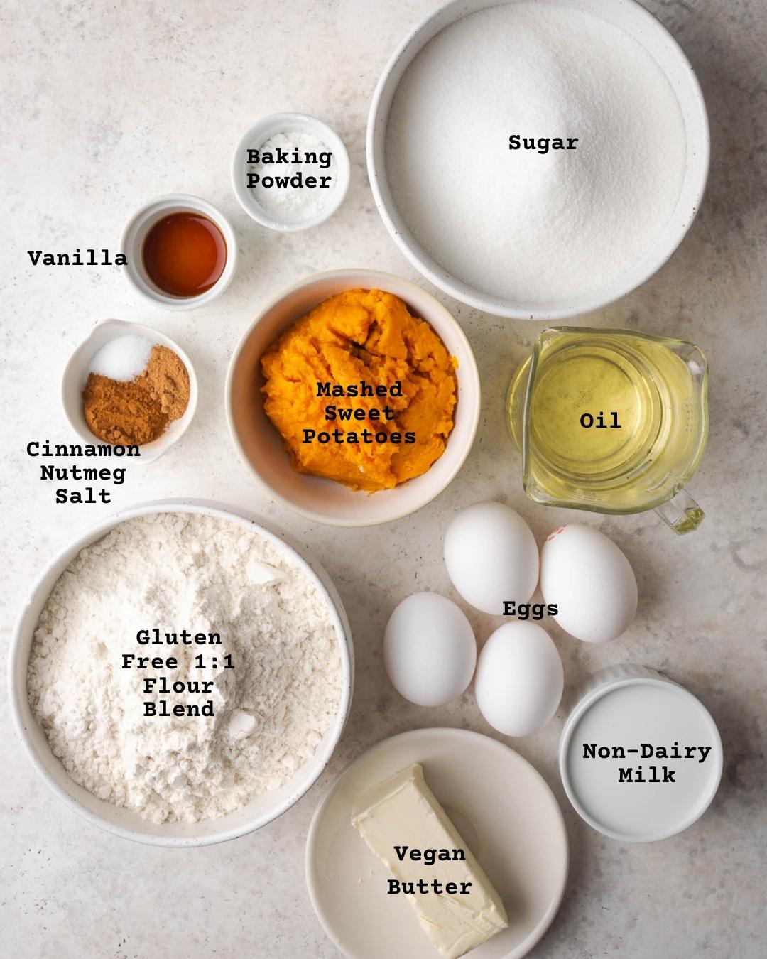 Ingredients for sweet potato cake on a white table.