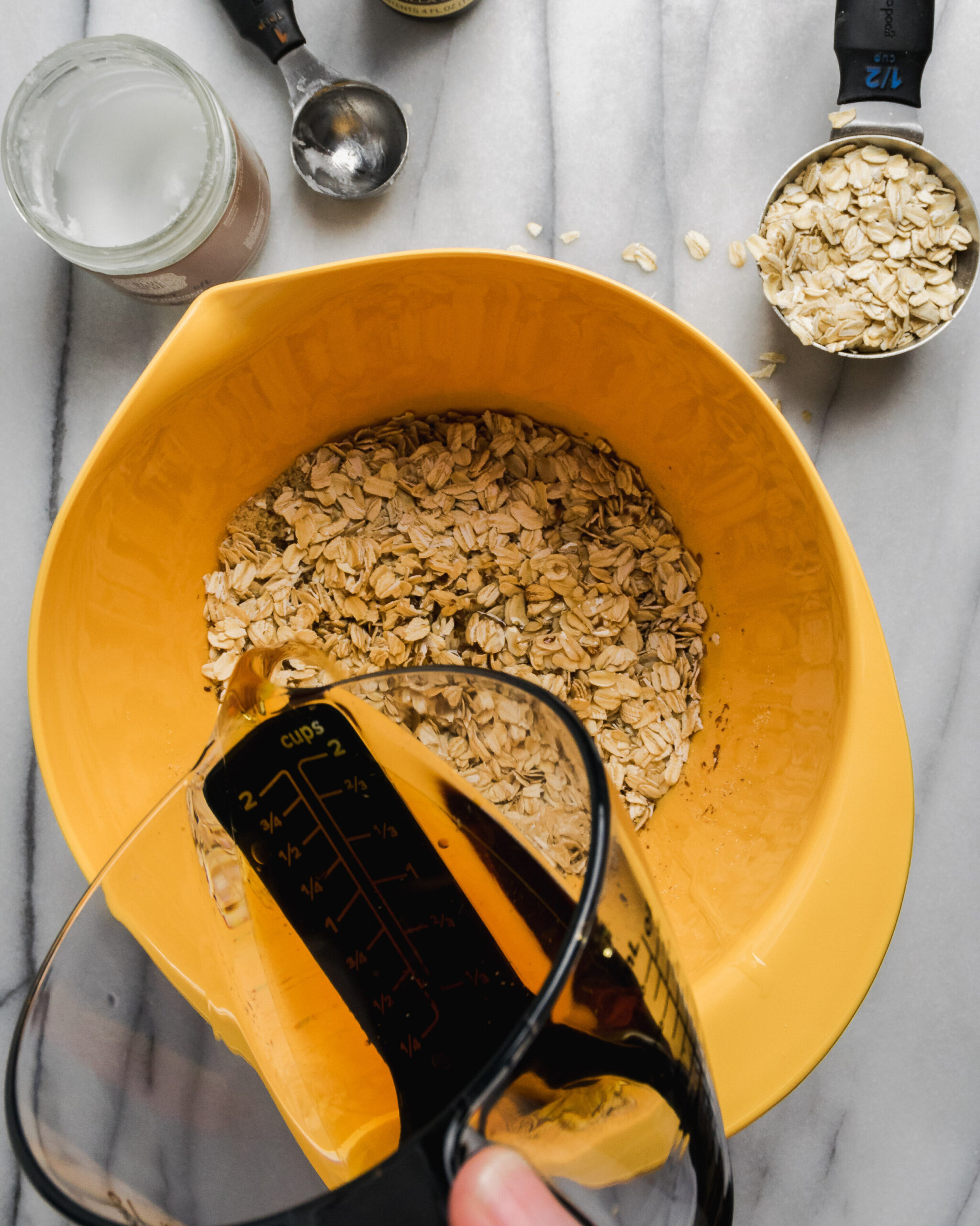 Wet ingredients being poured into dry ingredients.