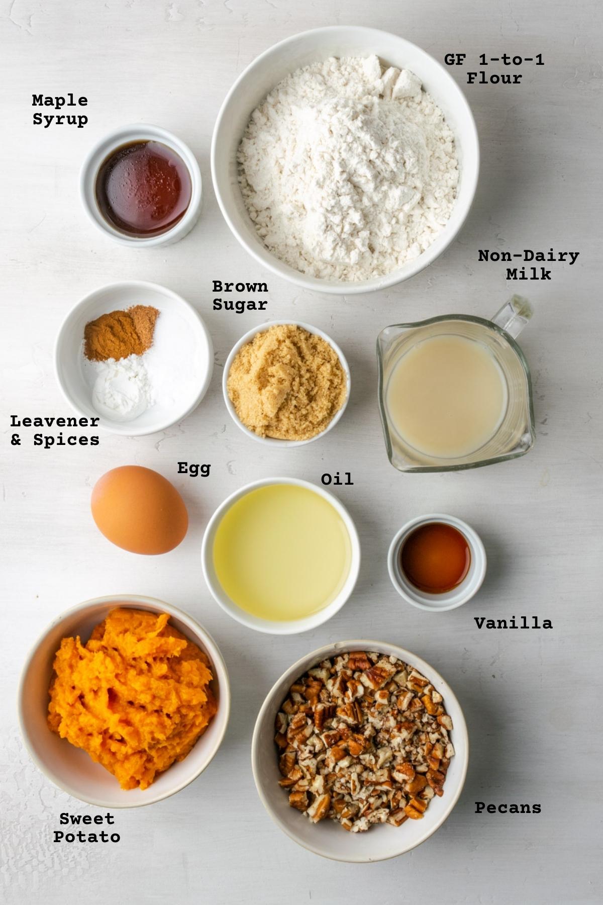 Ingredients for sweet potato bread on a white table.