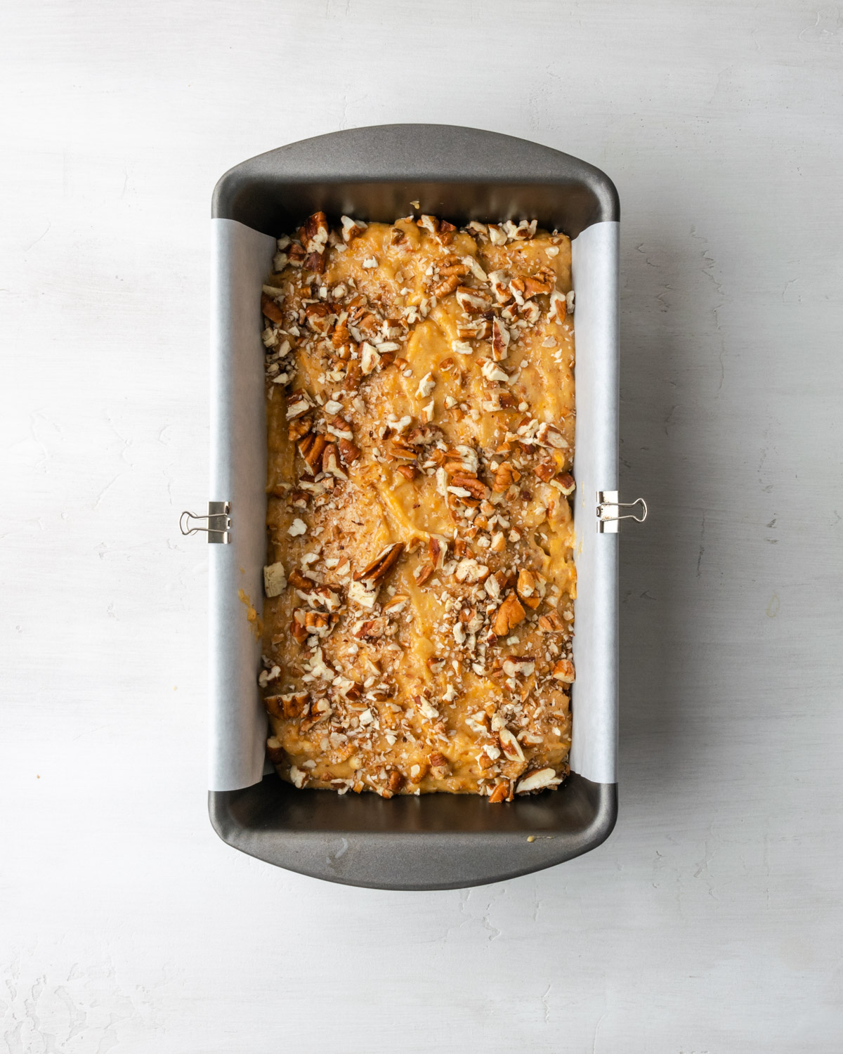 Sweet potato bread batter in a loaf pan.