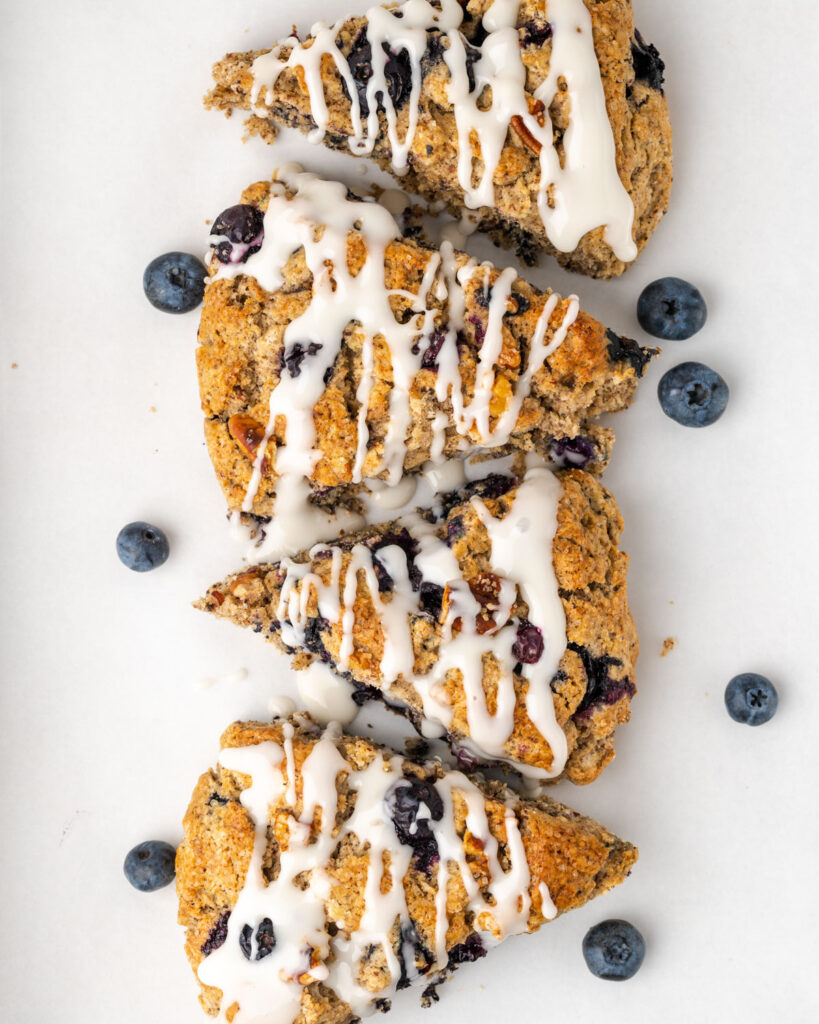Blueberry scones drizzled with vanilla icing.
