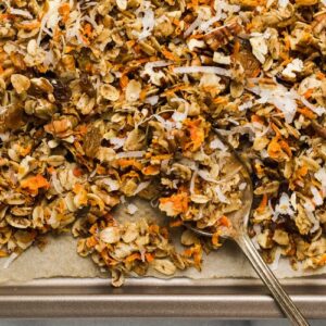 Carrot cake granola on a baking sheet.