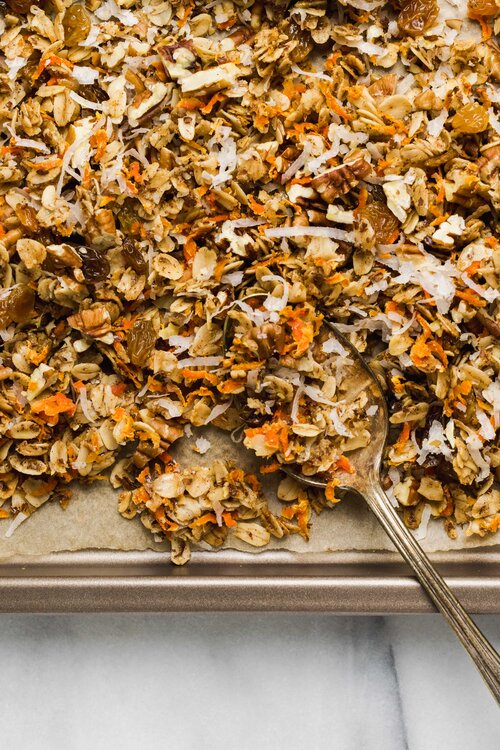 Carrot cake granola on a baking sheet.