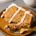 Slice of carrot cake on a plate.