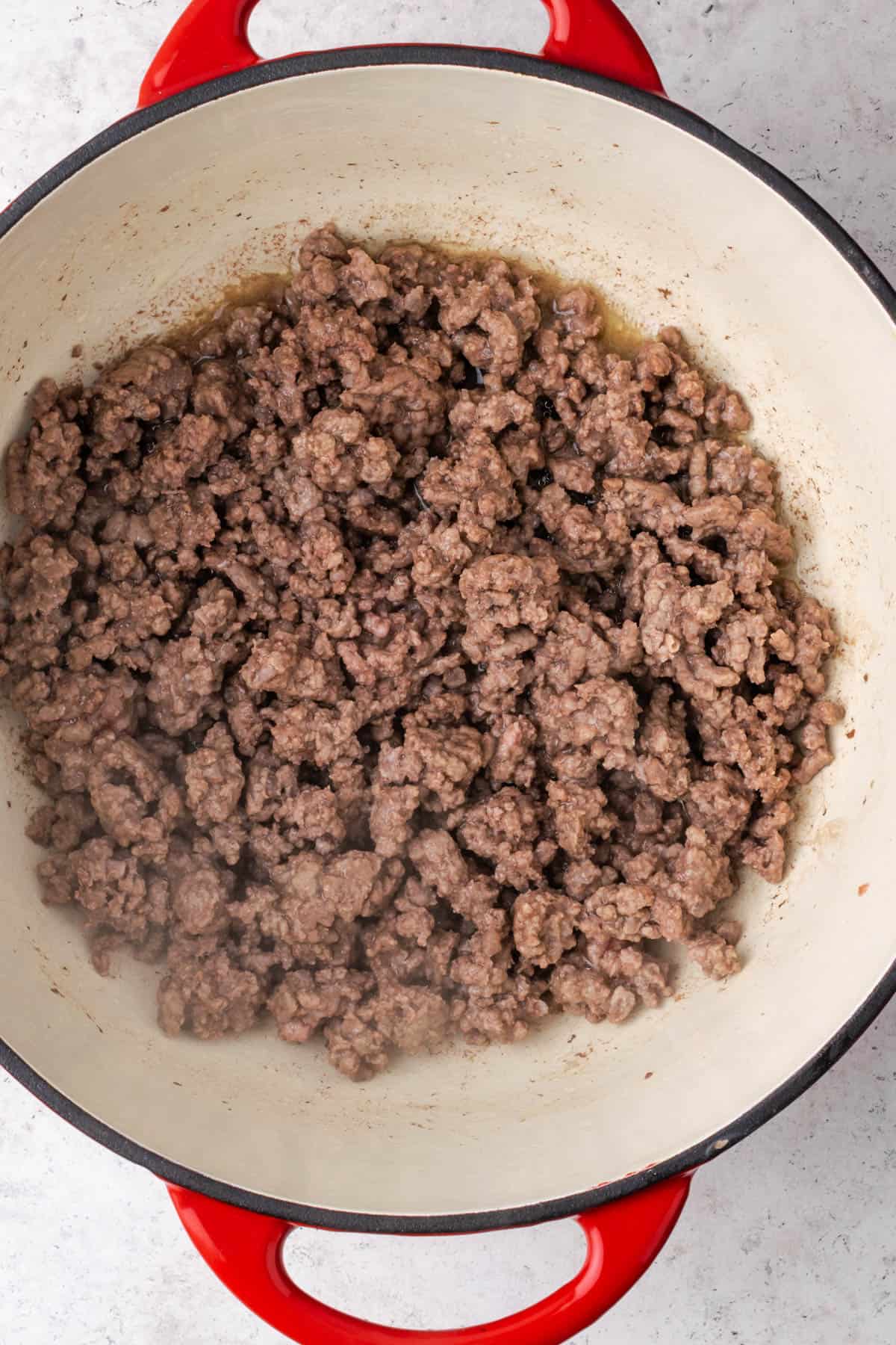 Ground beef browned in a large pot.