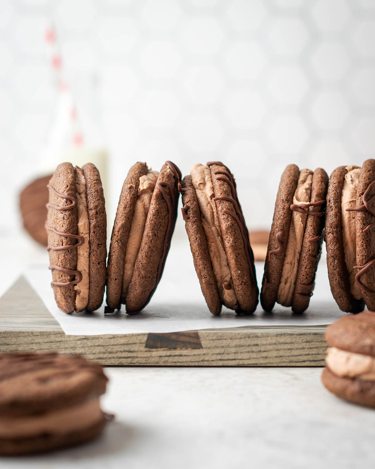 Homemade fudge rounds on a cutting board with a bottle of milk.