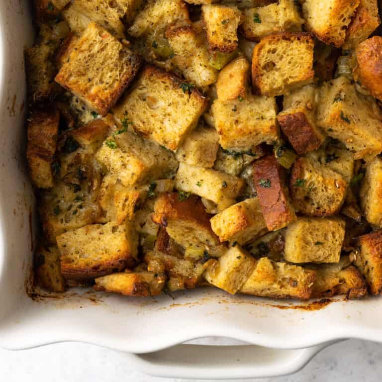 A white baking dish of gluten free stuffing.