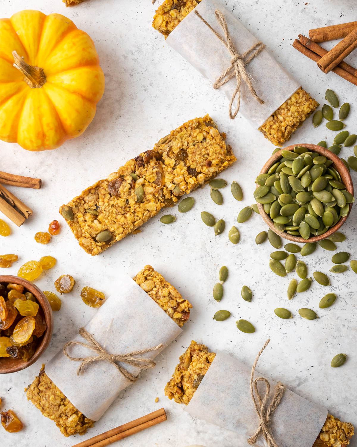 Pumpkin granola bars on a white table.