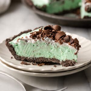 A slice of chocolate mint pie on a white plate.