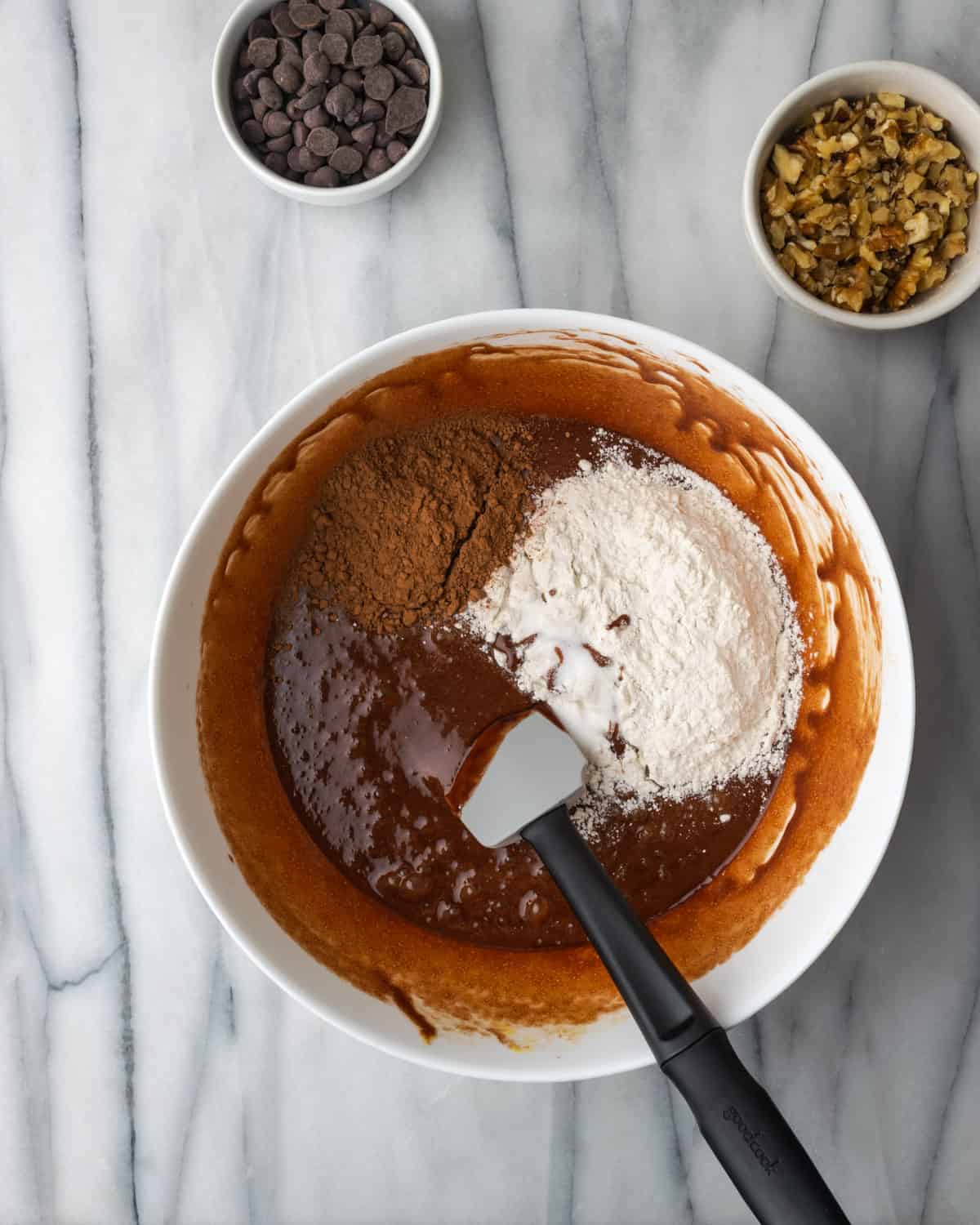 Flour and cocoa powder added to the melted chocolate mixure.