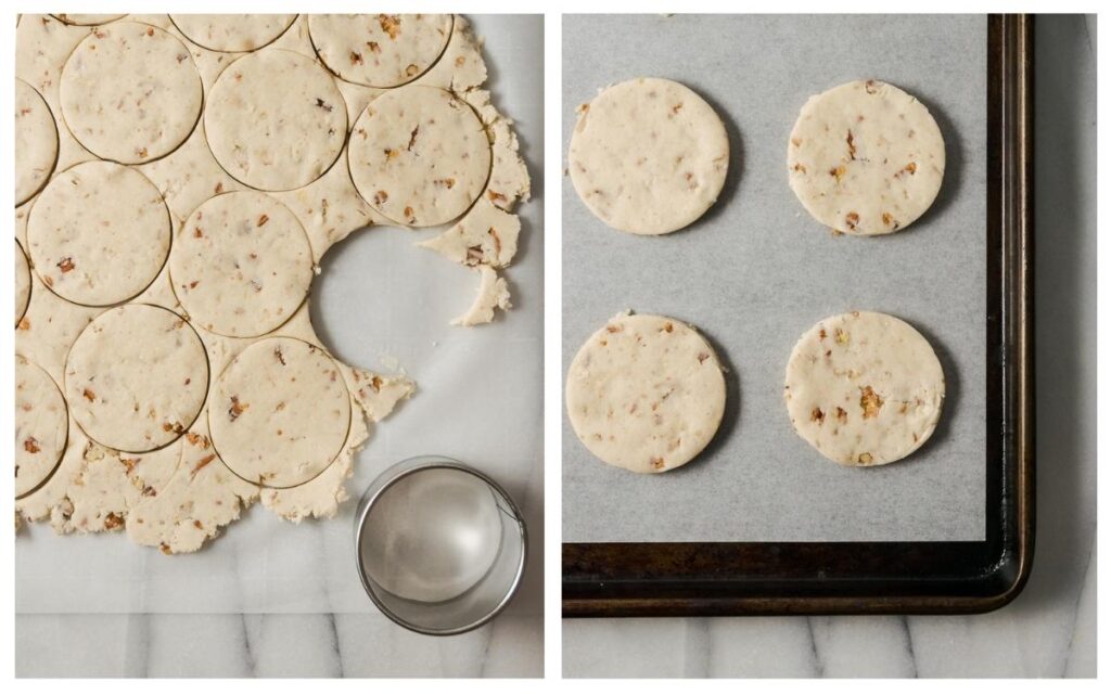 Rolled out cookie dough being cut with a round cutter and placed on a baking sheet.