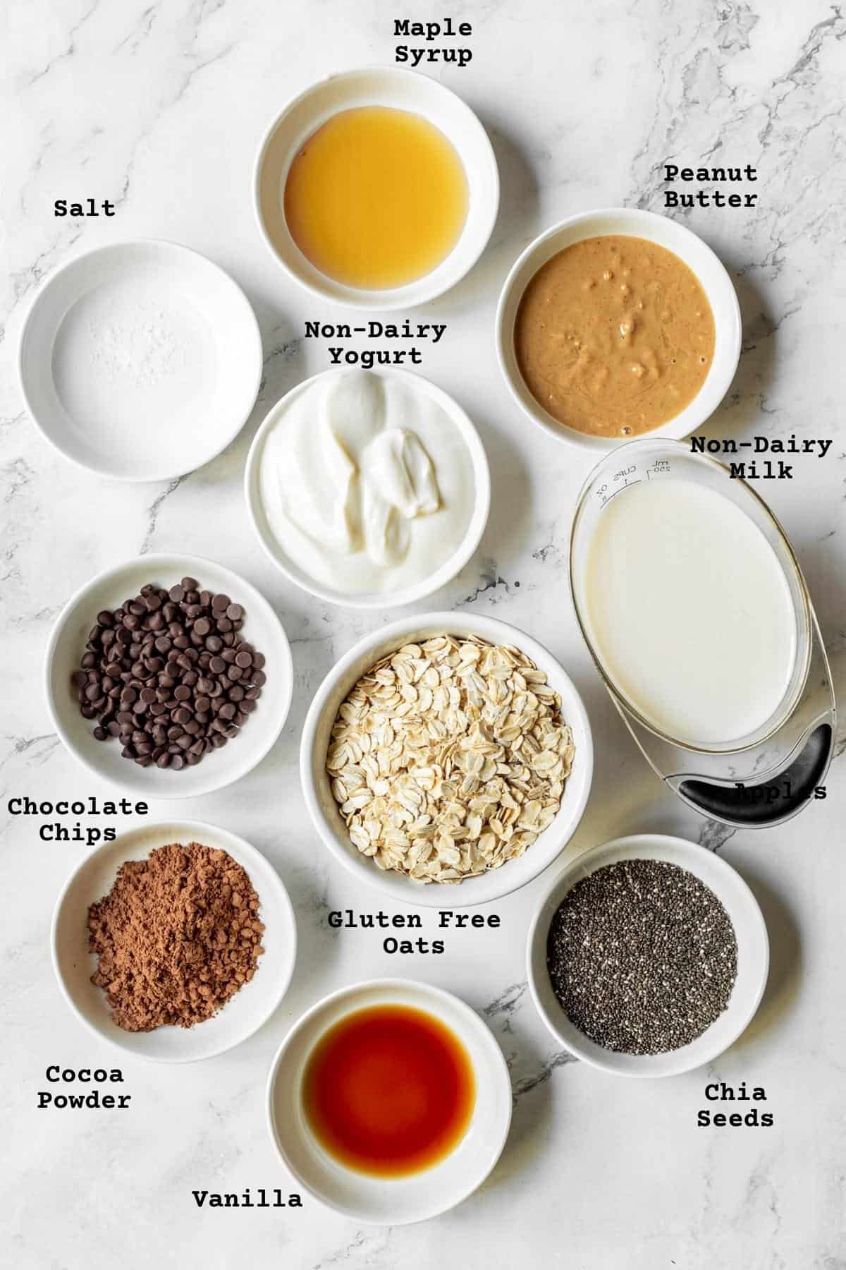 Ingredients for overnight oats on a marble table.