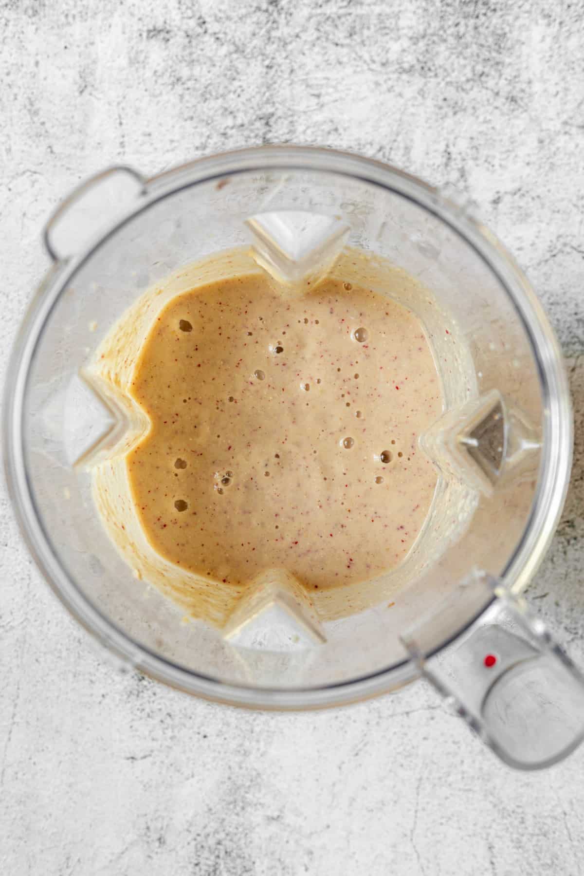 Pureed apple smoothie in a blender.