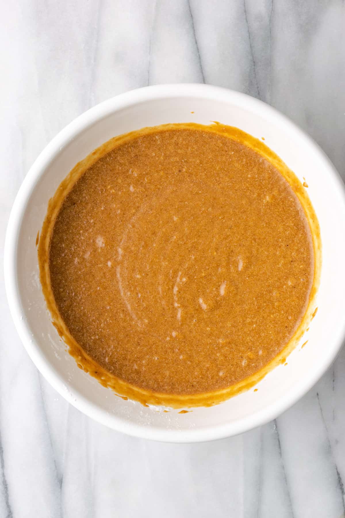 Mixed pie filling in a large white bowl.