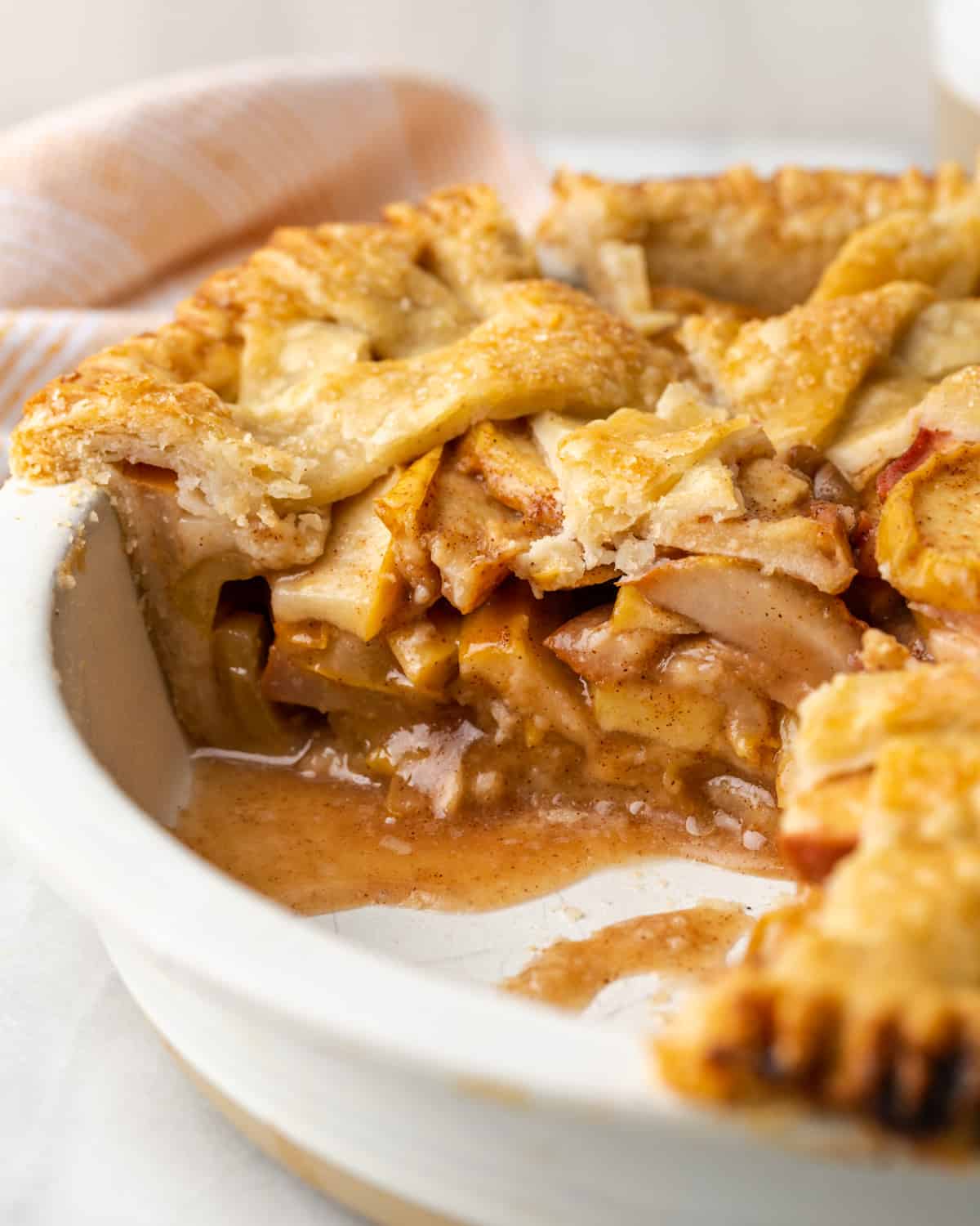 Interior of apple pear pie sliced and showing layers of fruit and sauce.