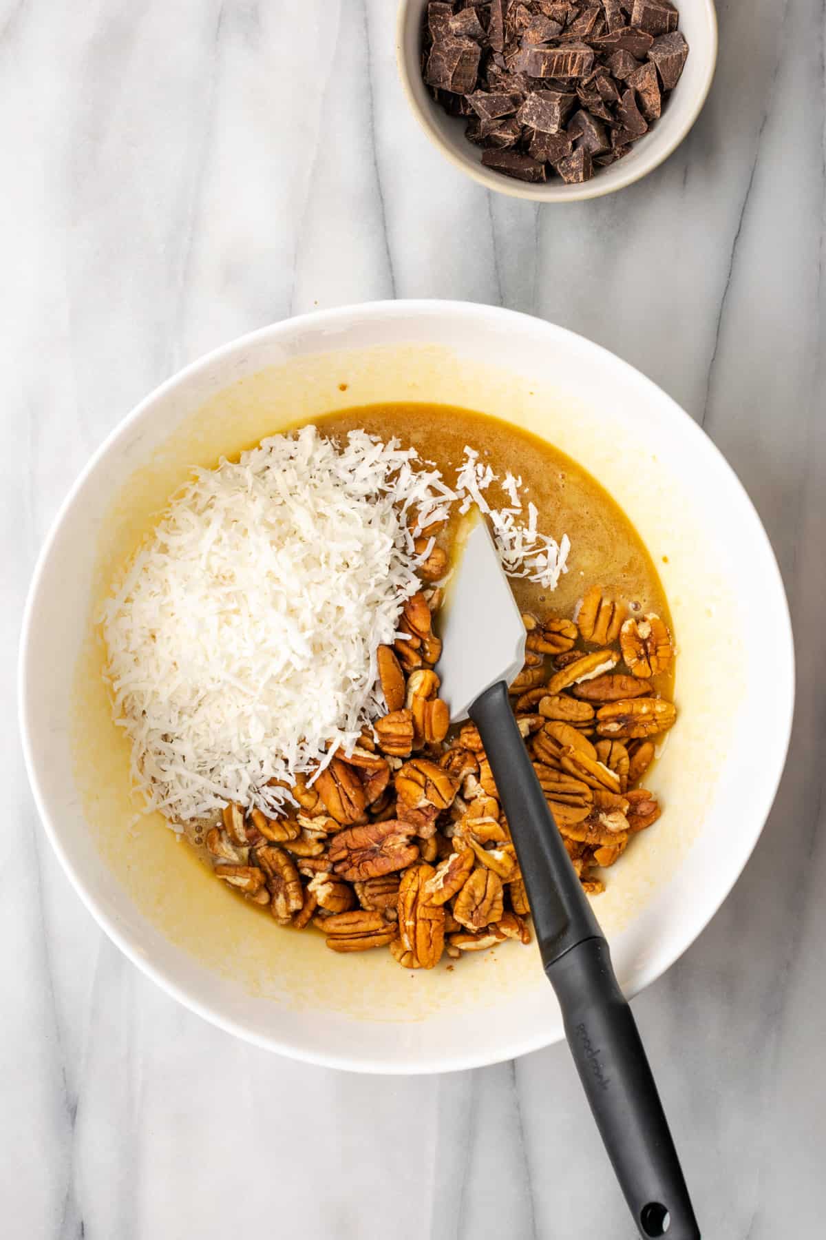 Coconut and pecans being added to the west ingredients.