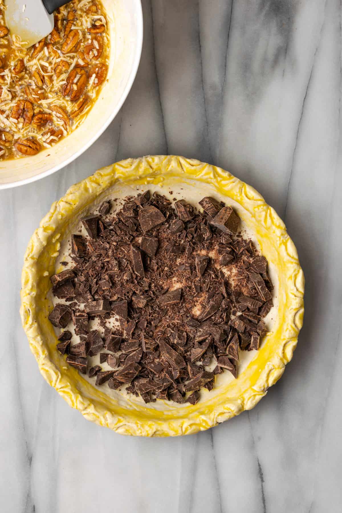 Chopped chocolate spread into the bottom of an unbaked pie shell.