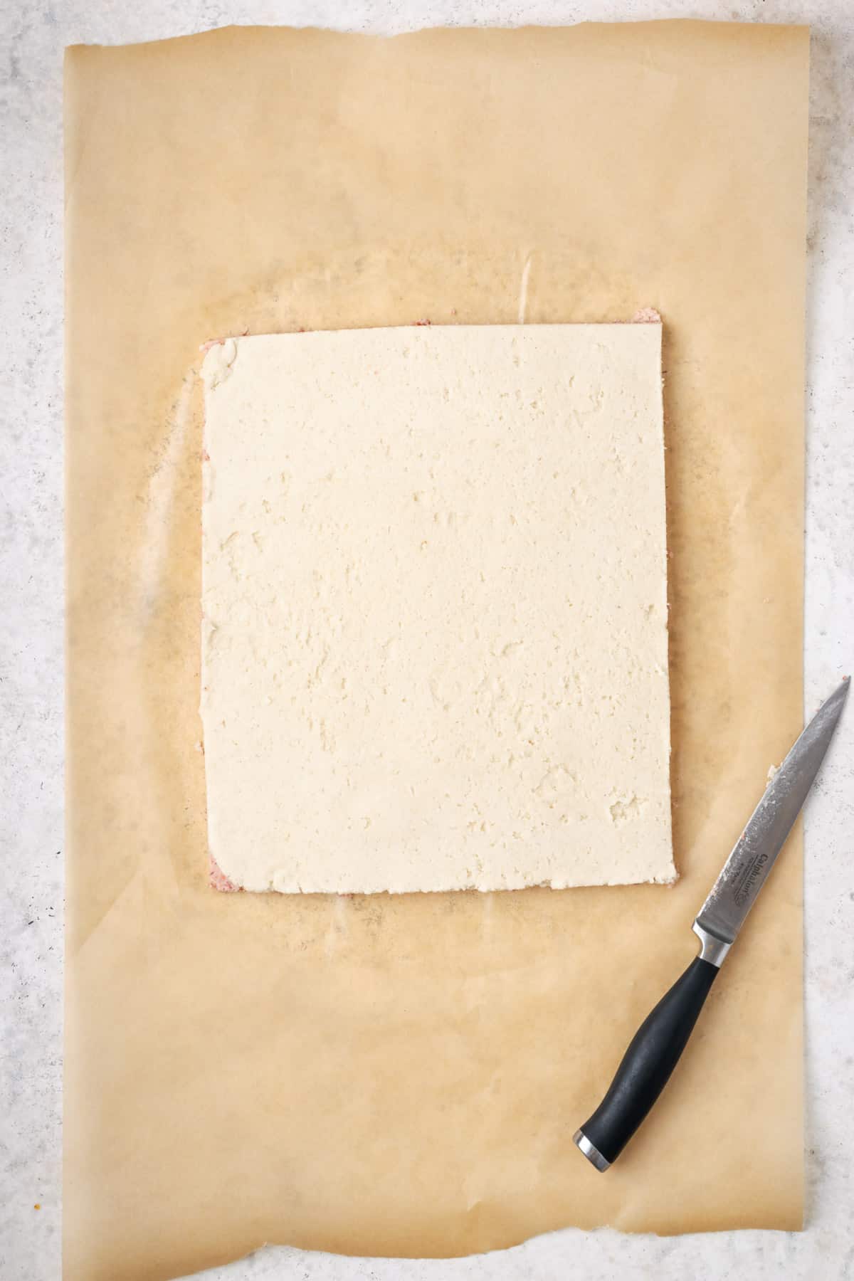 Two pieces of dough trimmed into a perfect rectangle.