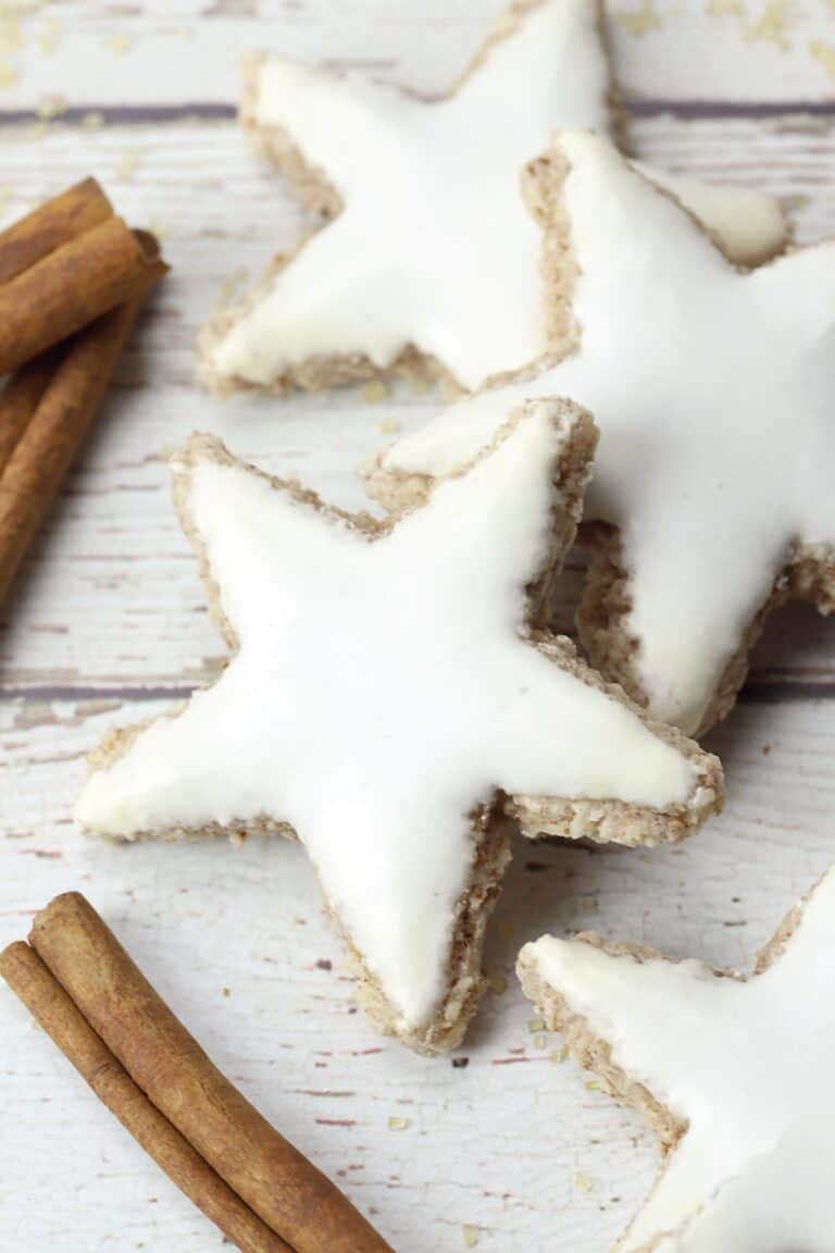 Star shaped cookies covered with white icing.