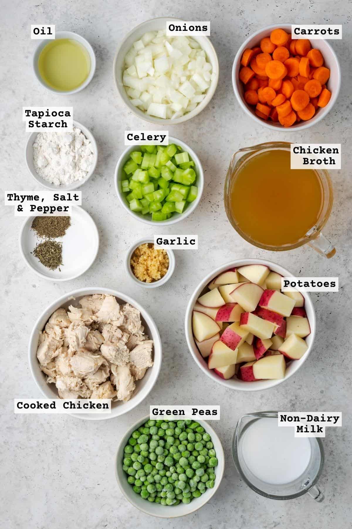 Ingredients for instant pot chicken pot pie on a white table.