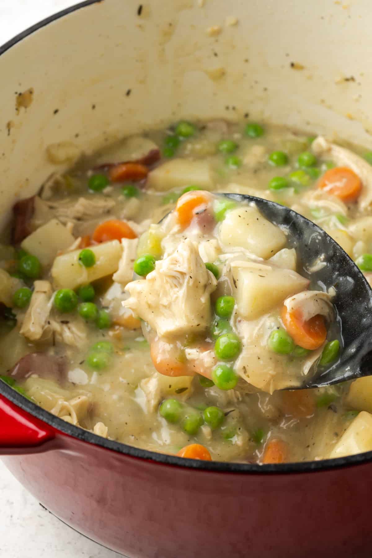 A closeup of the creamy chicken pot pie filling before it is poured into the pie crust.