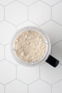 Processed oat flour in a blender jar.
