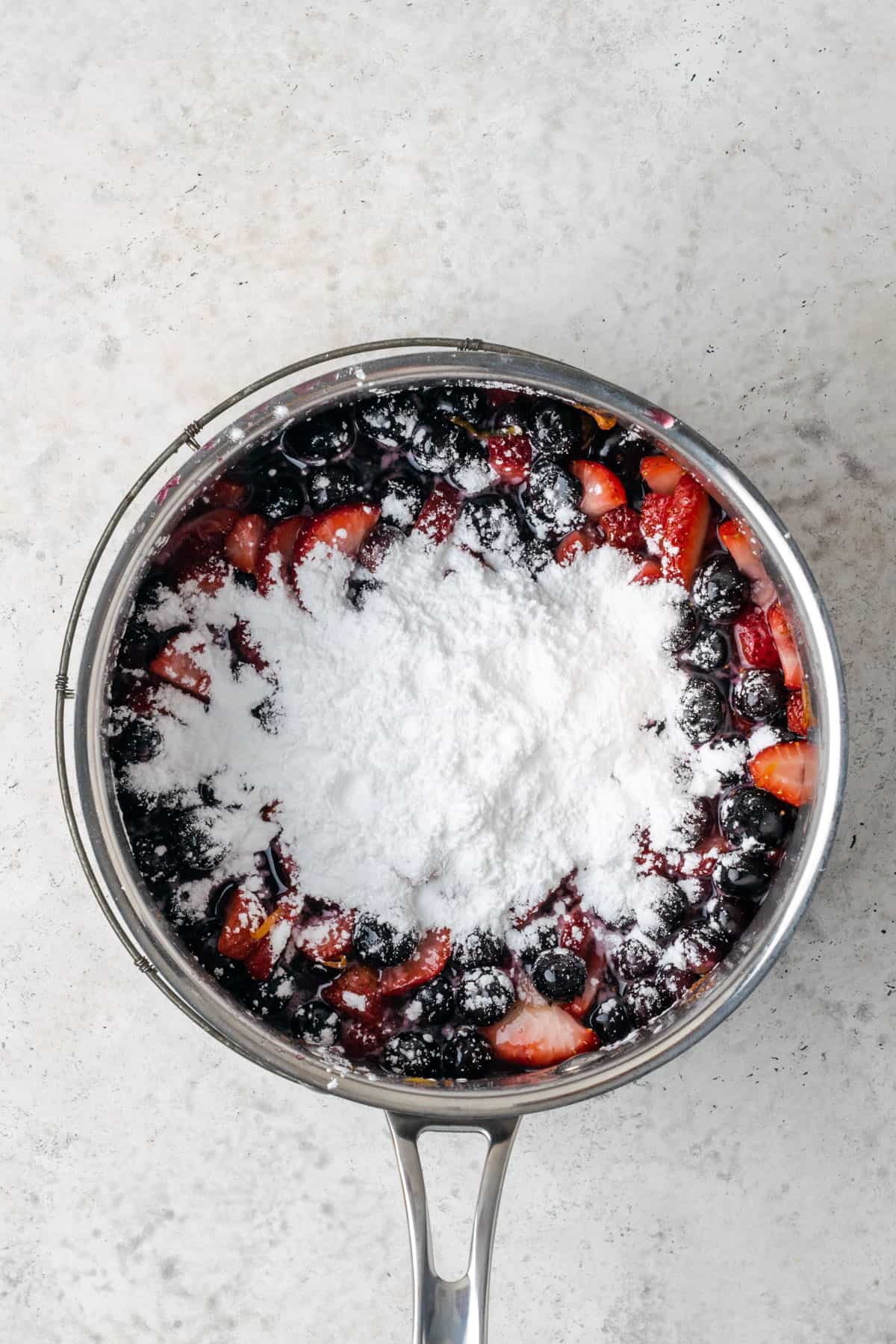 Cooked blueberries and strawberries with tapioca starch mixed in.