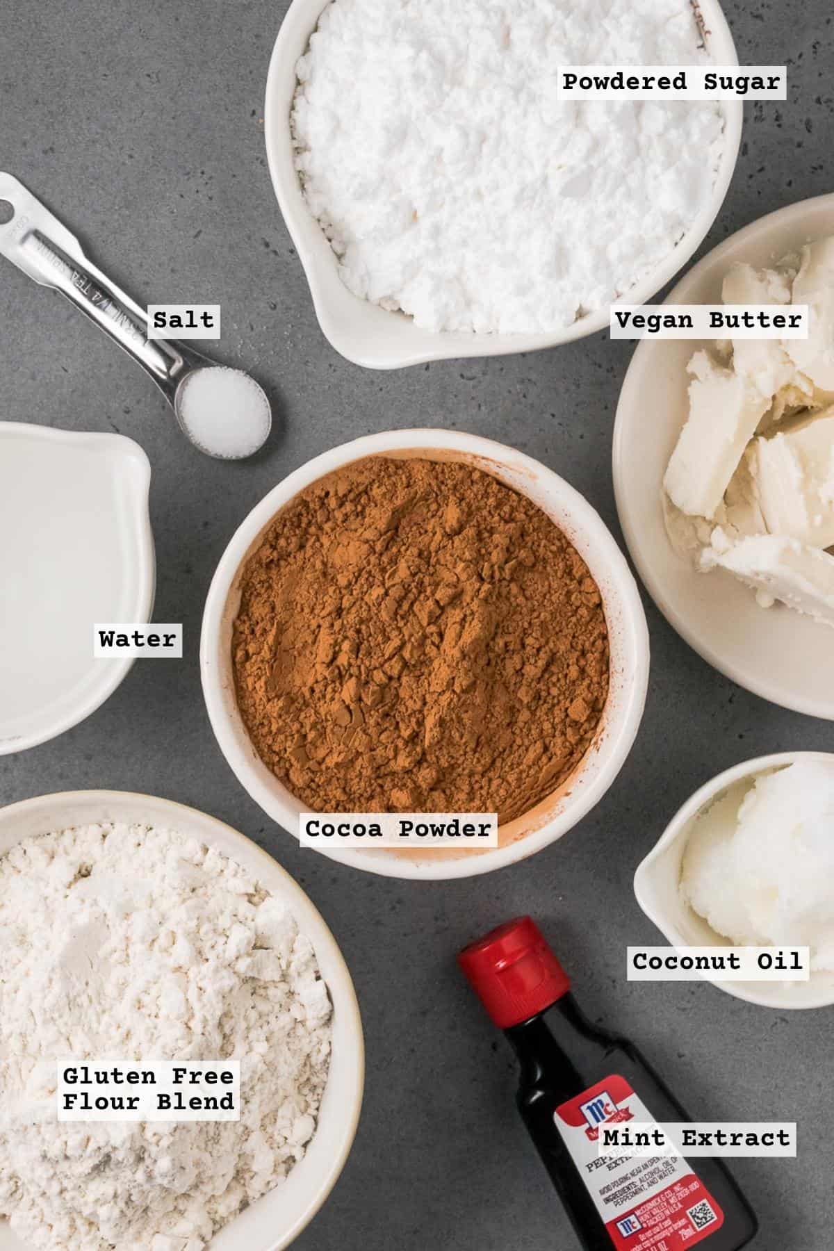 Ingredients for gluten free thin mints on a grey table.