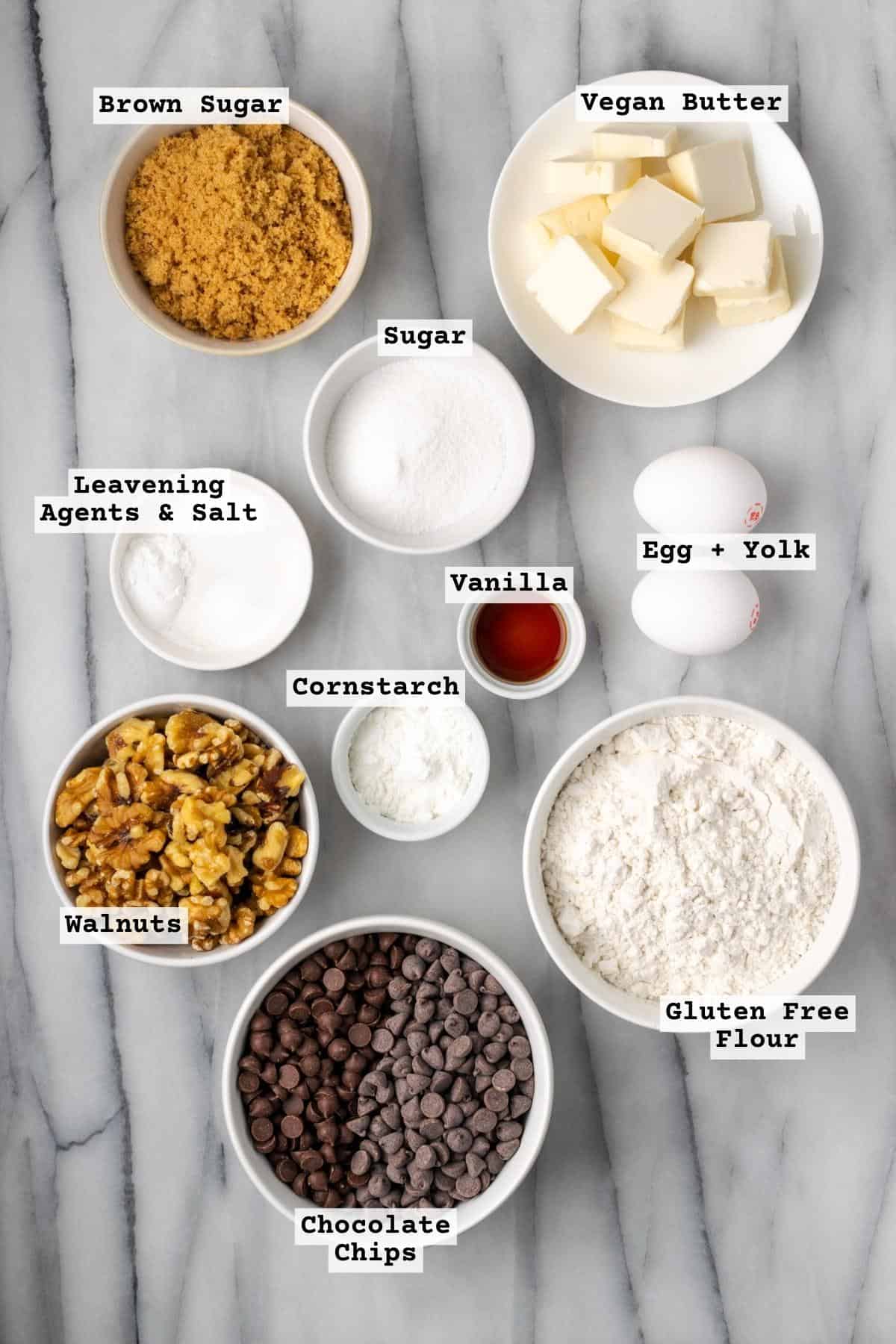 Ingredients for Levain chocolate chip cookies on a white marble table.