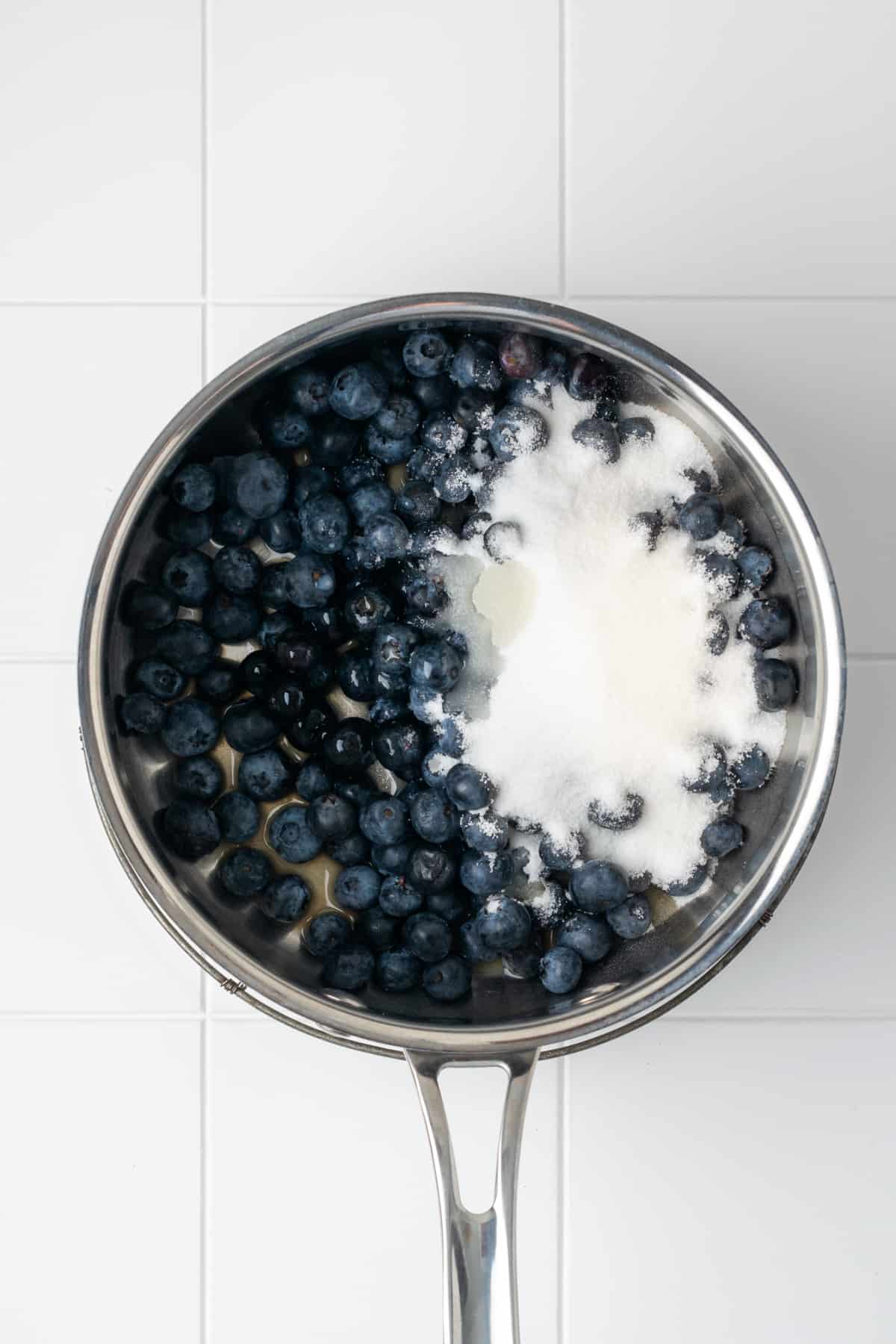 Blueberries, sugar, lemon juice and vanilla combined in a saucepan.