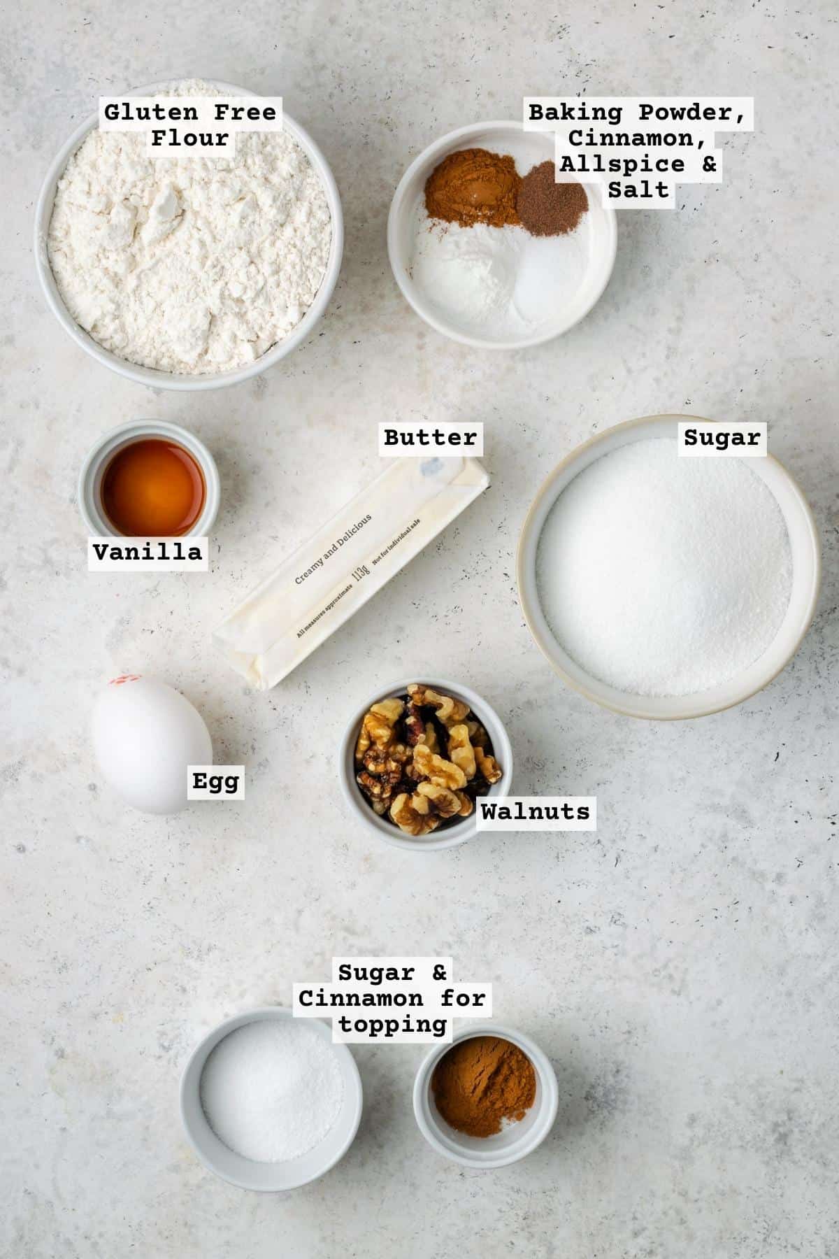 Ingredients for cinnamon sugar cookies on a white table. 