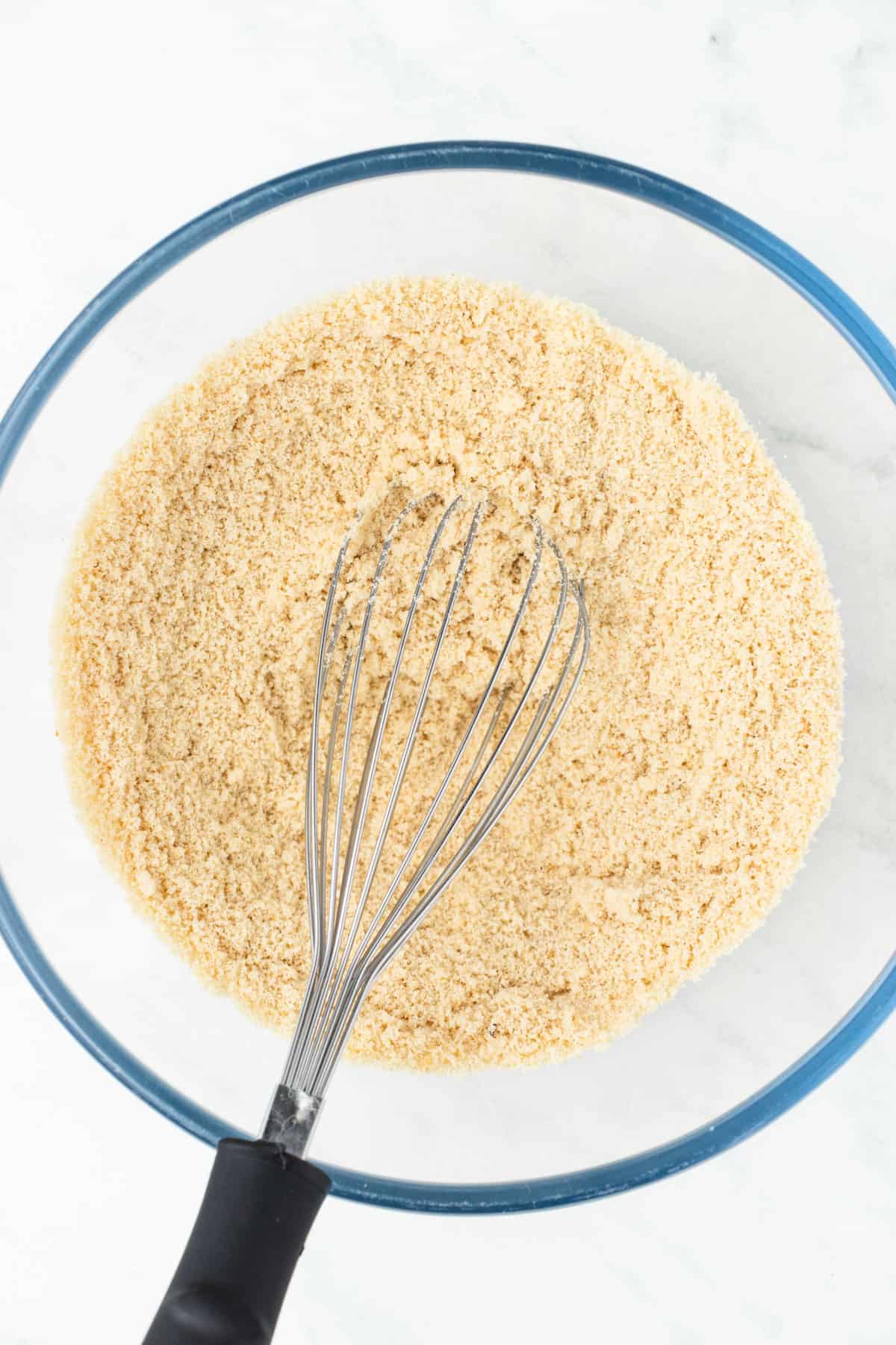 Almond flour, baking powder and salt combined in a large mixing bowl.
