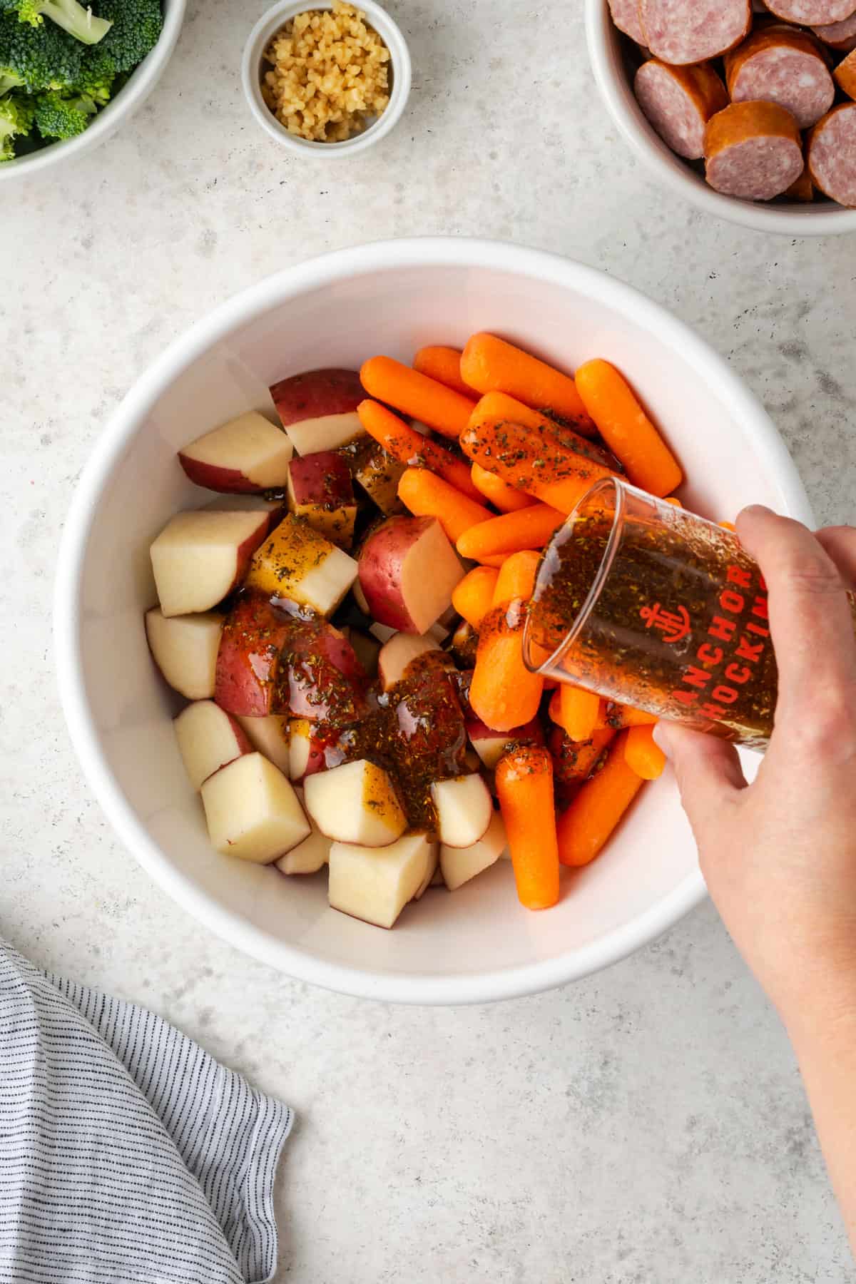 Cut potatoes and carrots in a large mixing bowl. 