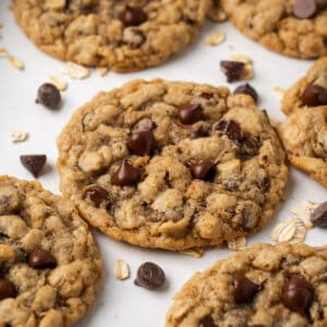 Gluten free oatmeal chocolate chip cookies lying on a baking sheet.