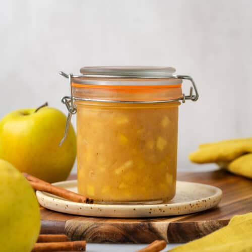 A small jar filled with homemade apple pie filling.