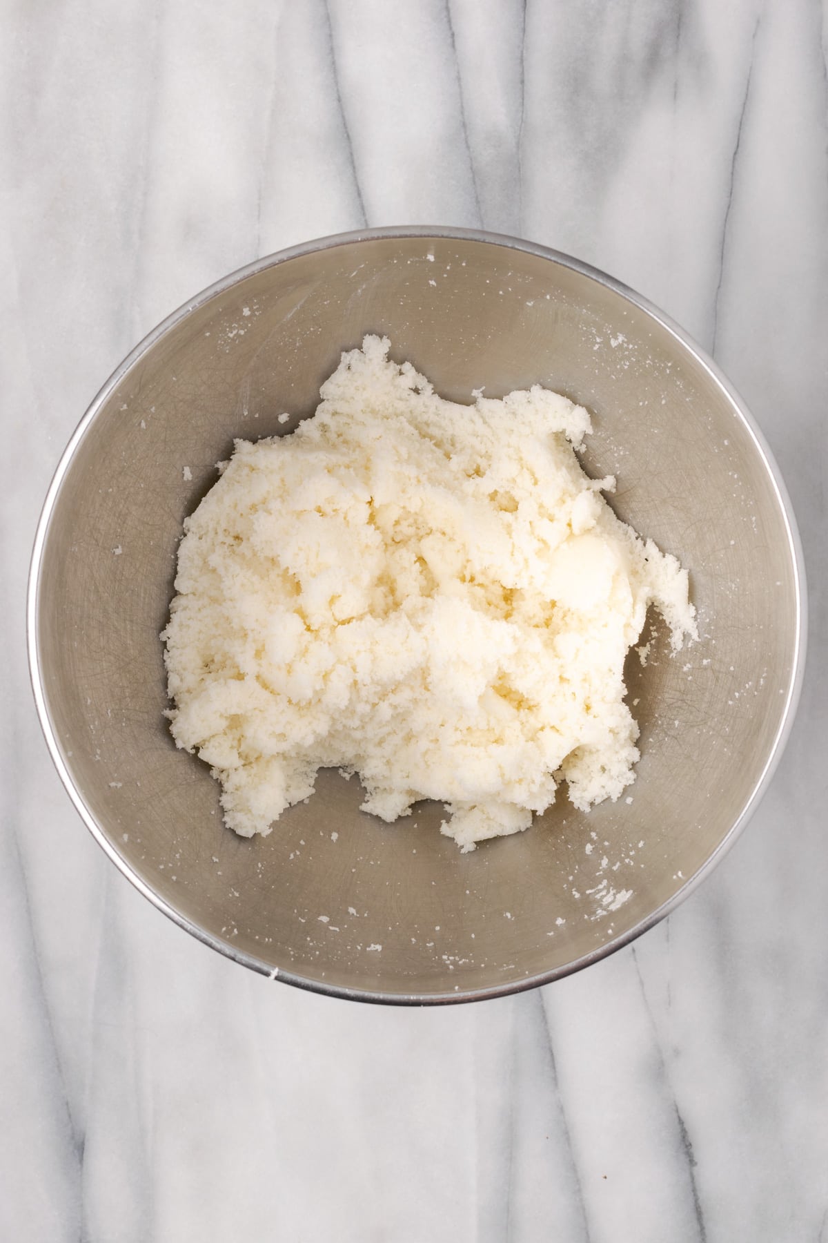 Vegan butter and sugar creamed together in a large mixing bowl.