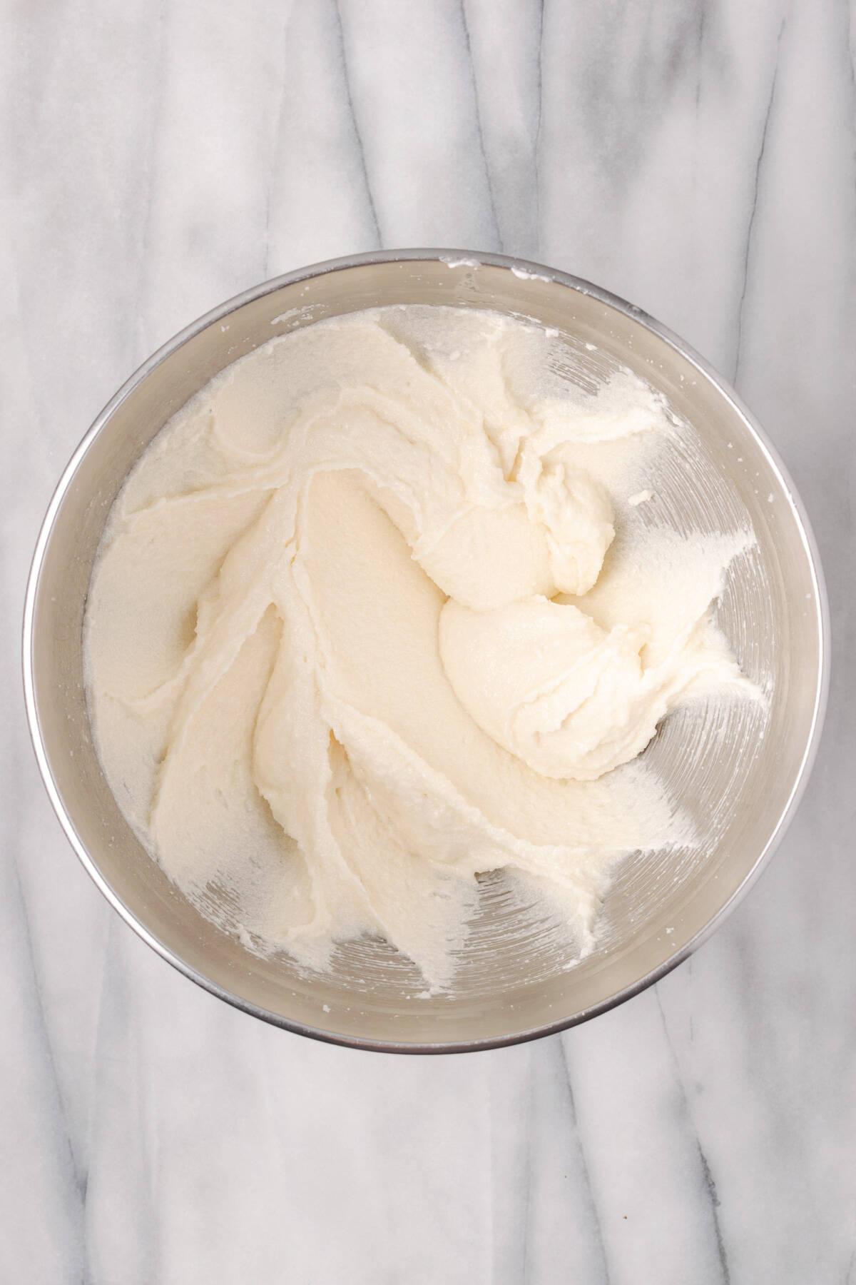 Oil beaten into the creamed butter and sugar mixture in a large mixing bowl. 