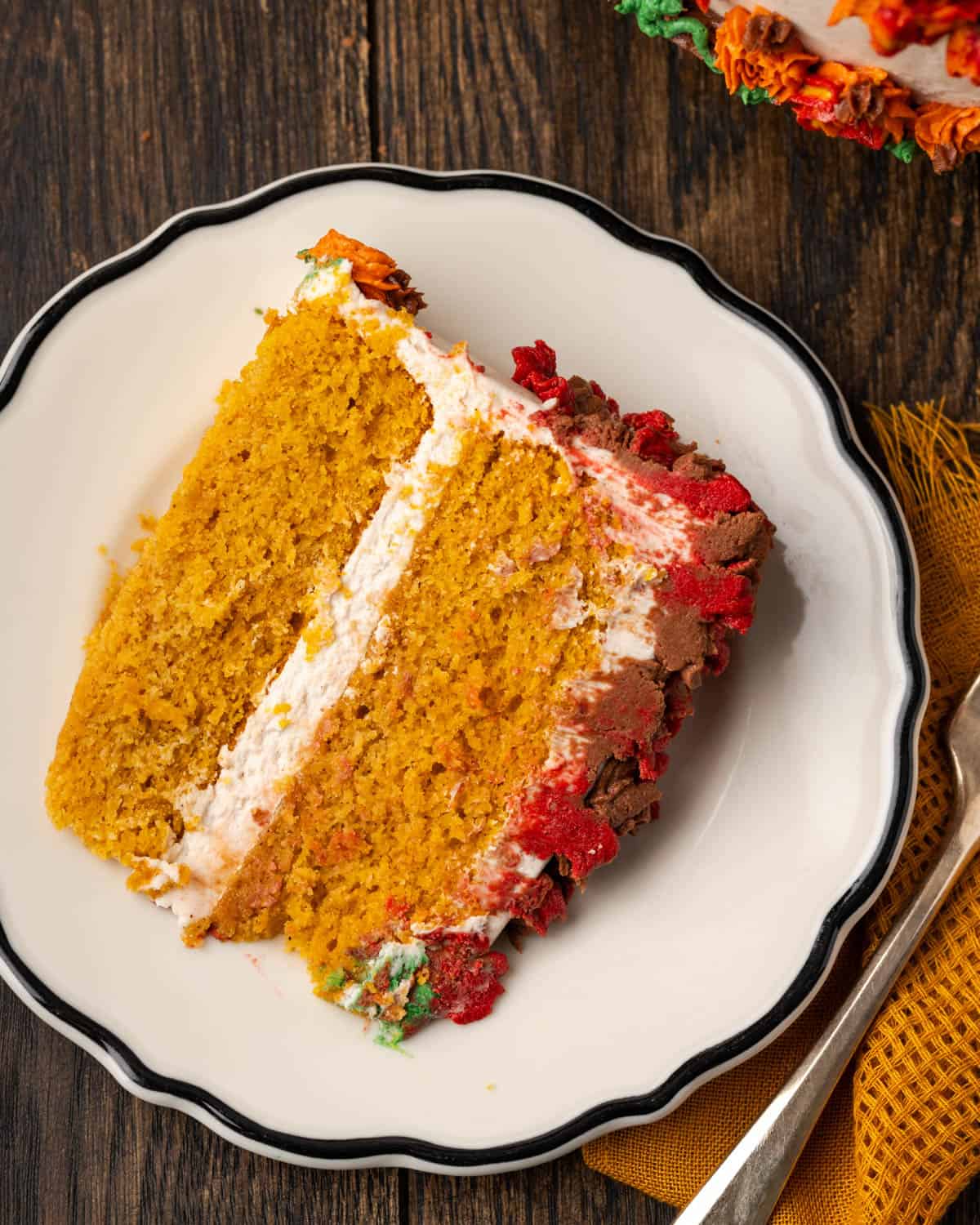 A slice of gluten free pumpkin cake served on a white plate.