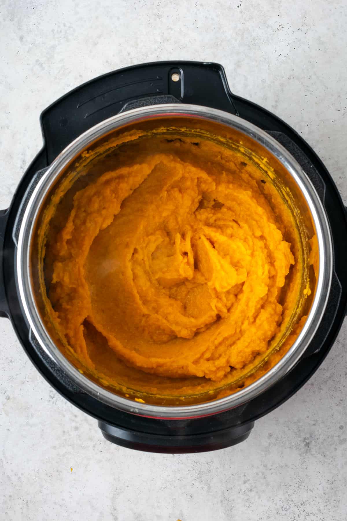 Whipped sweet potatoes sitting in an Instant Pot.