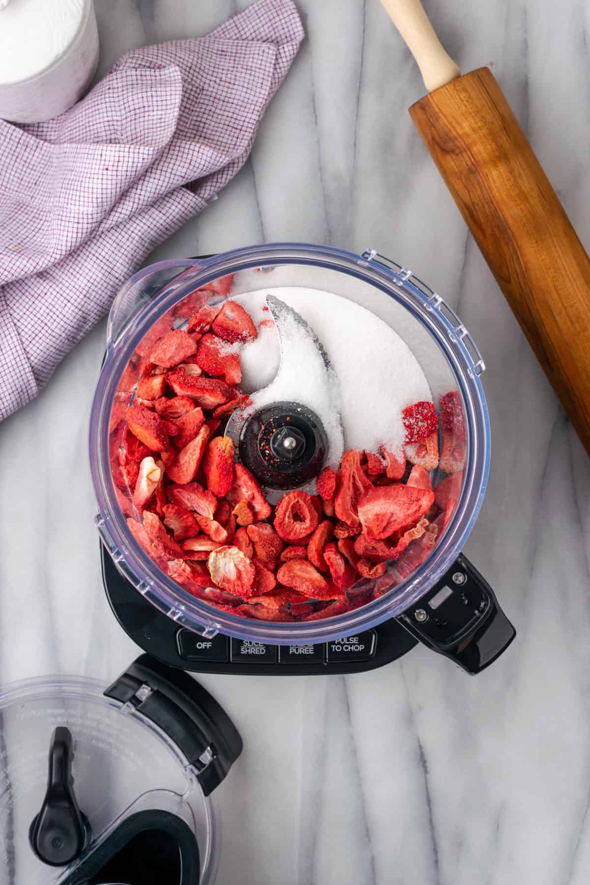 Freeze dried strawberries and sugar in a food processor.