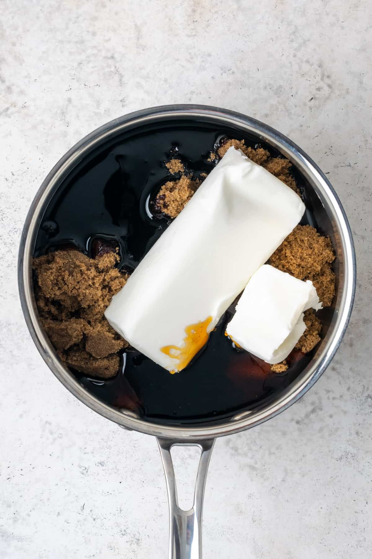 Dark brown sugar, molasses, corn syrup and vegetable shortening in a saucepan. 