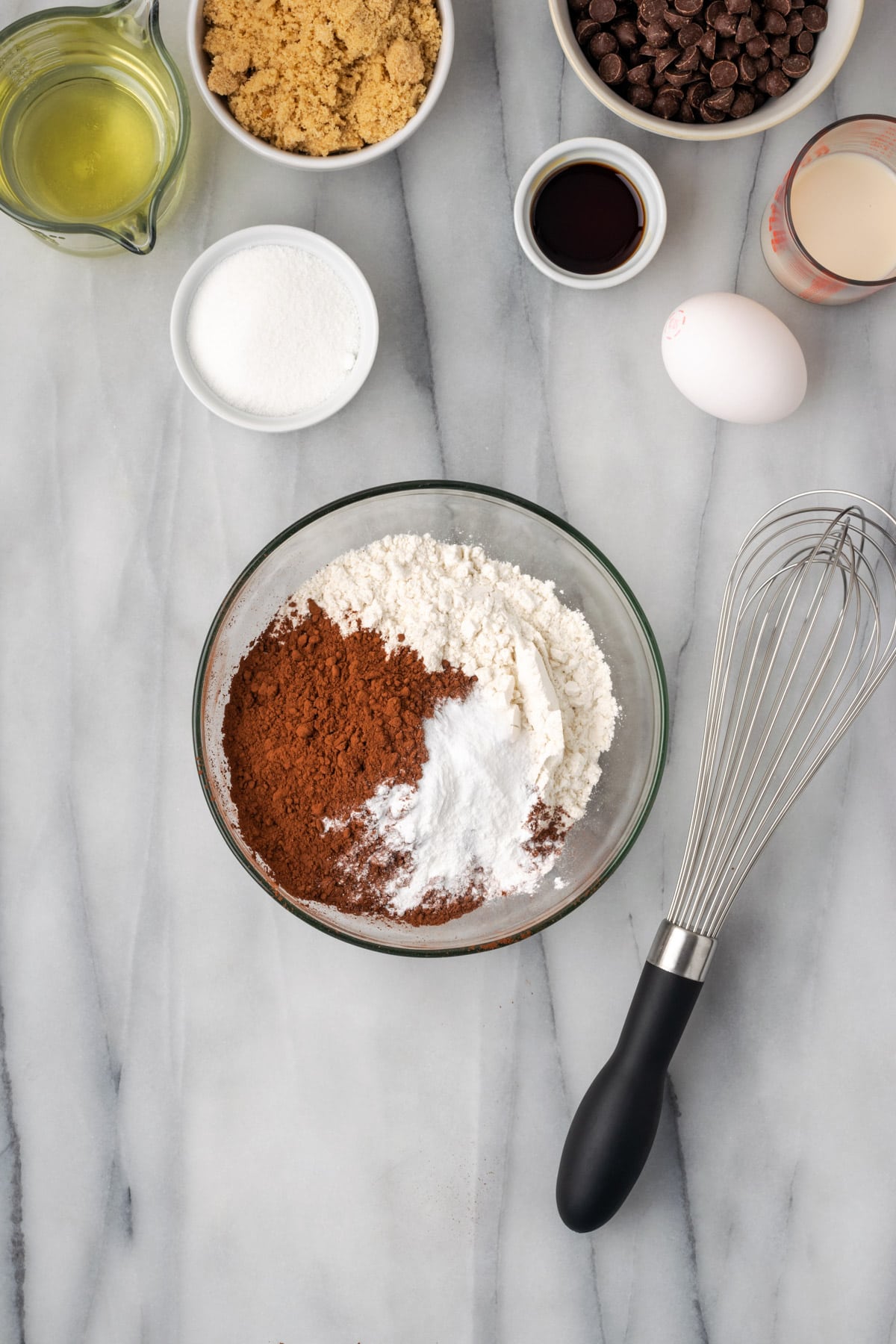 Gluten free flour, cocoa powder, baking powder, baking soda and salt combined in a small mixing bowl.