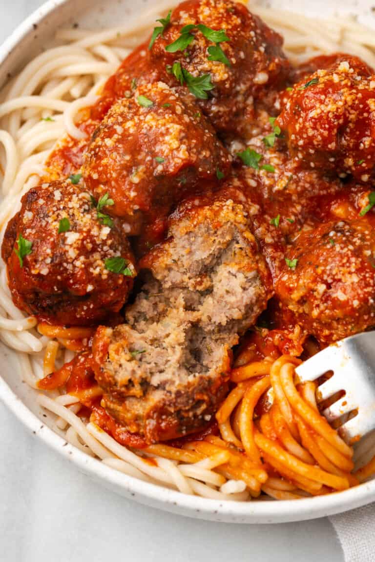 A plate of gluten free spaghetti and meatballs.