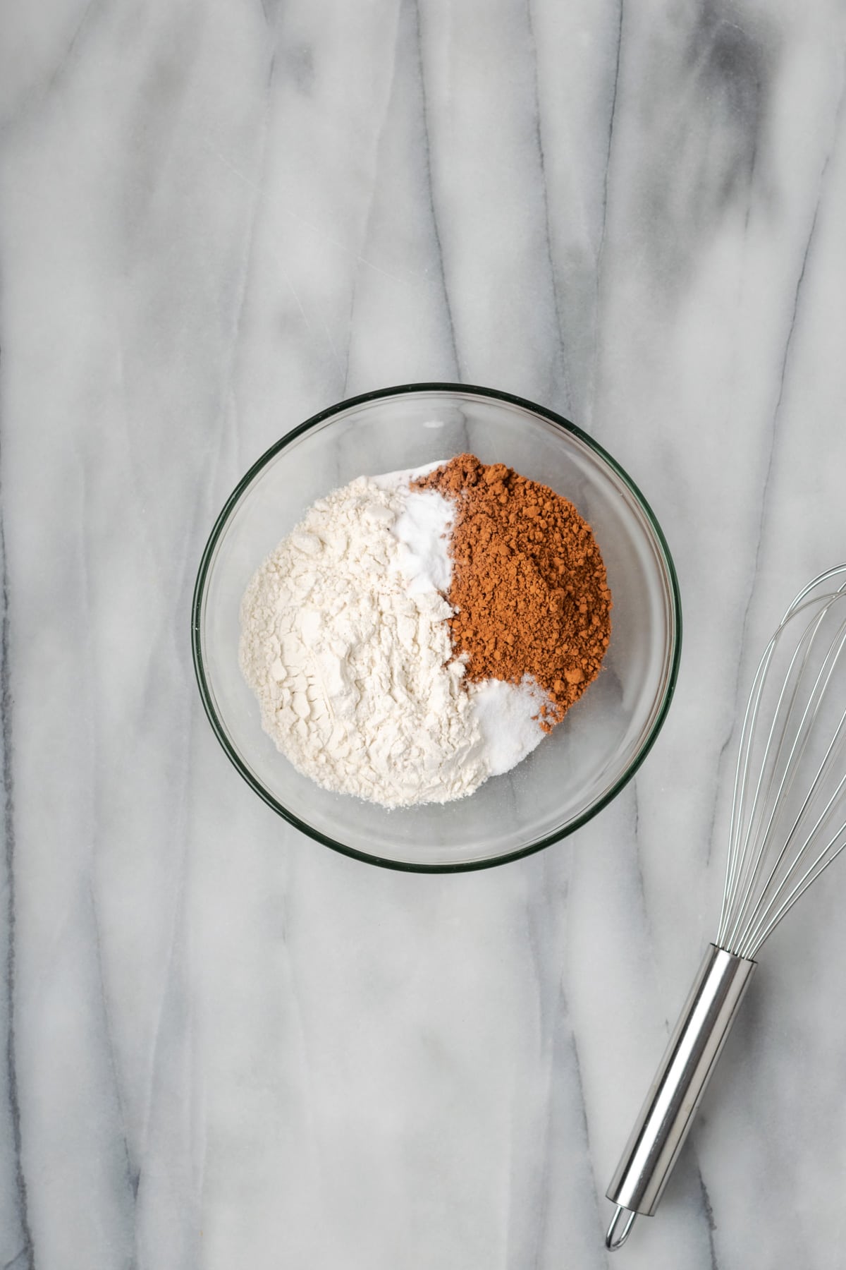 Gluten free flour, cocoa powder, baking soda and salt combined in a small mixing bowl. 