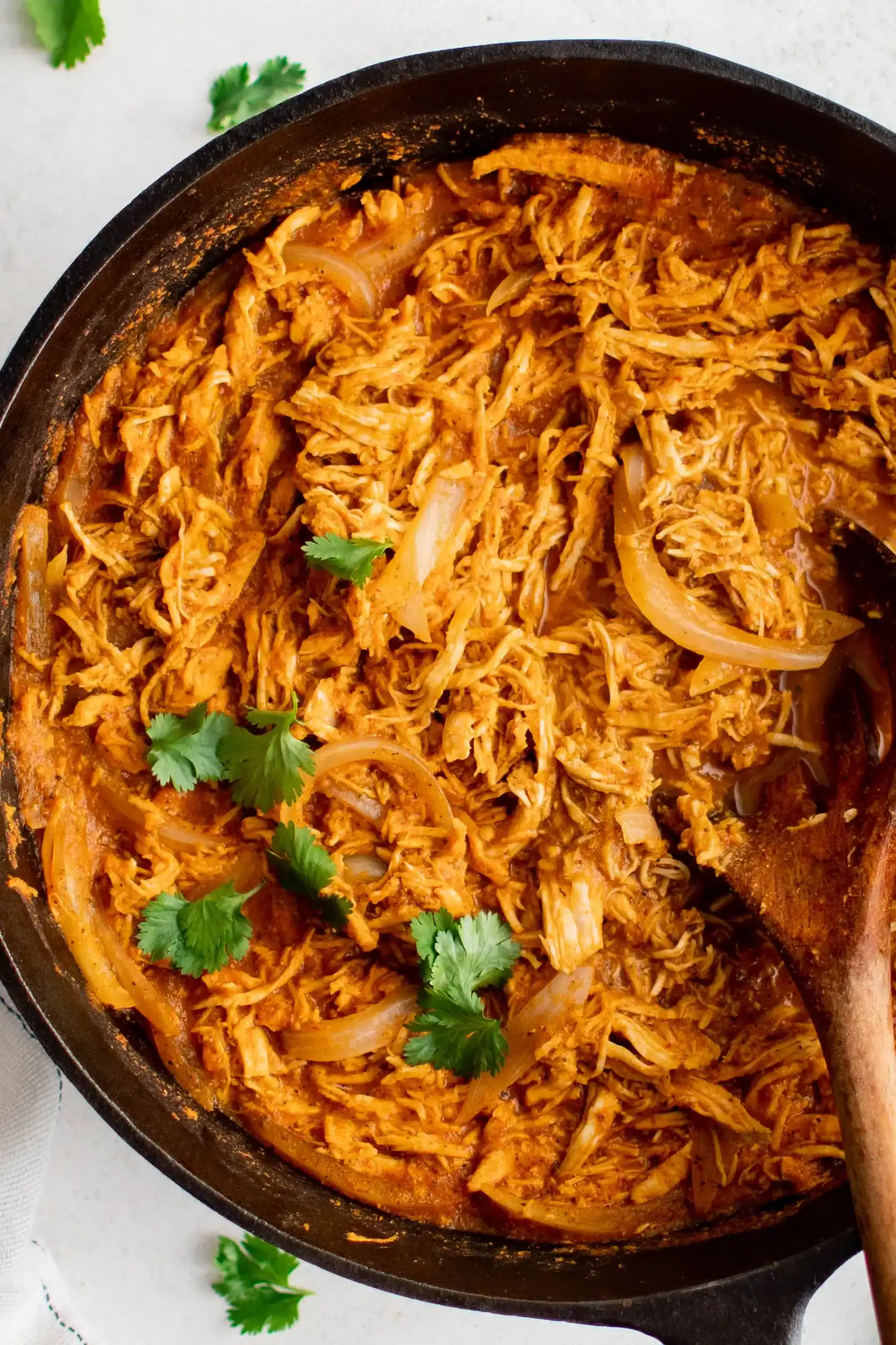 Chicken tinga in a large skillet.