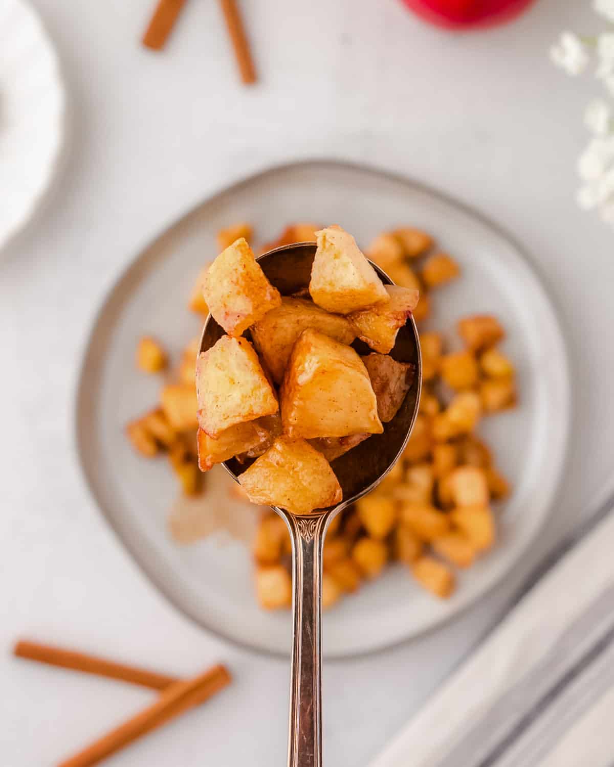 A spoonful of air fryer cinnamon apples. 