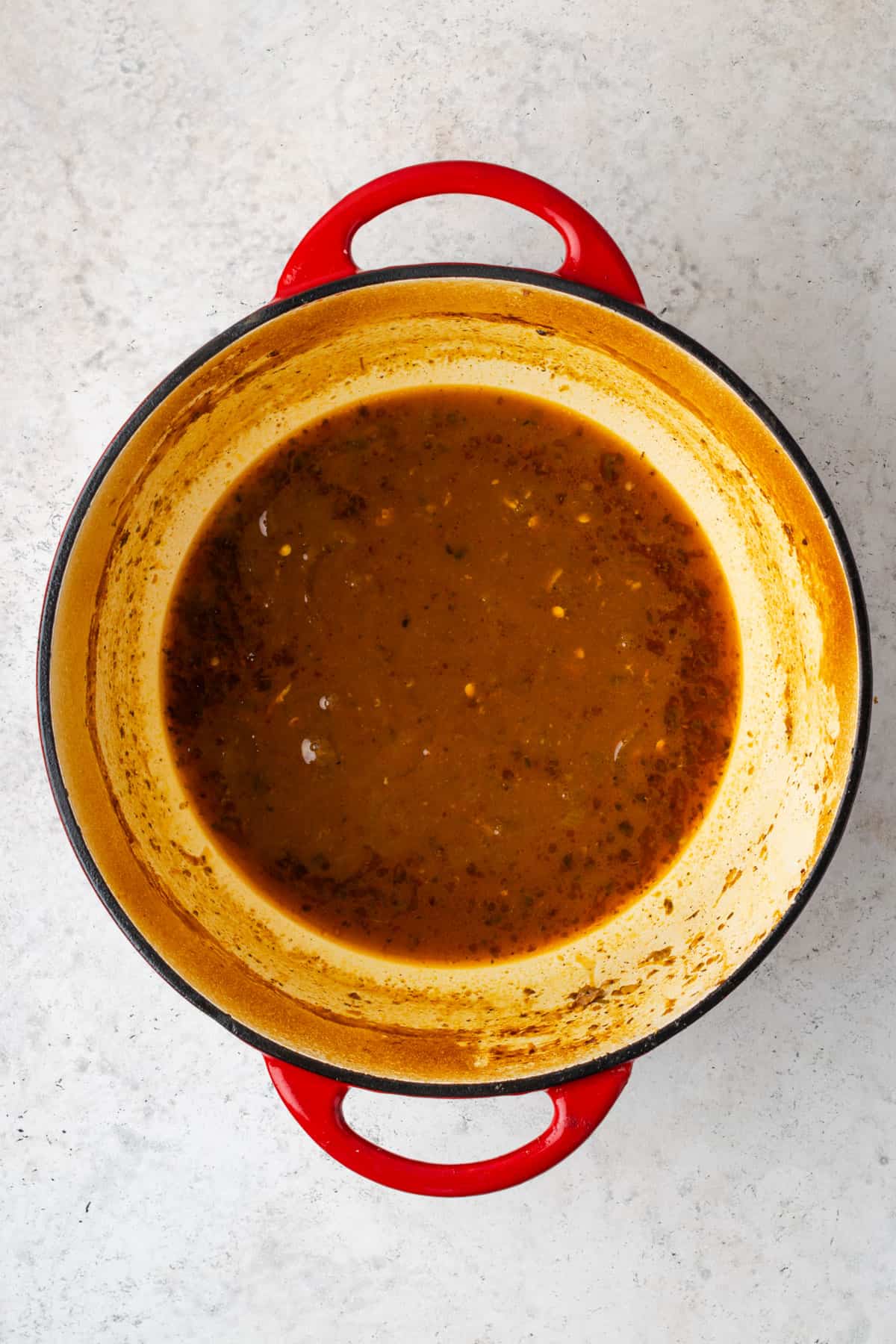 Braising liquid in a dutch oven.