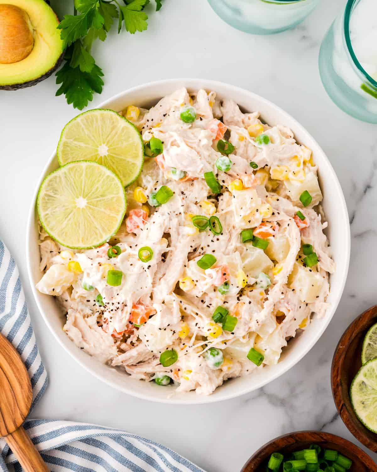 A bowl of Mexican chicken salad sitting on a white countertop. 